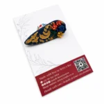 NAVY AND GOLD EMBOSSED FLORAL BROOCH